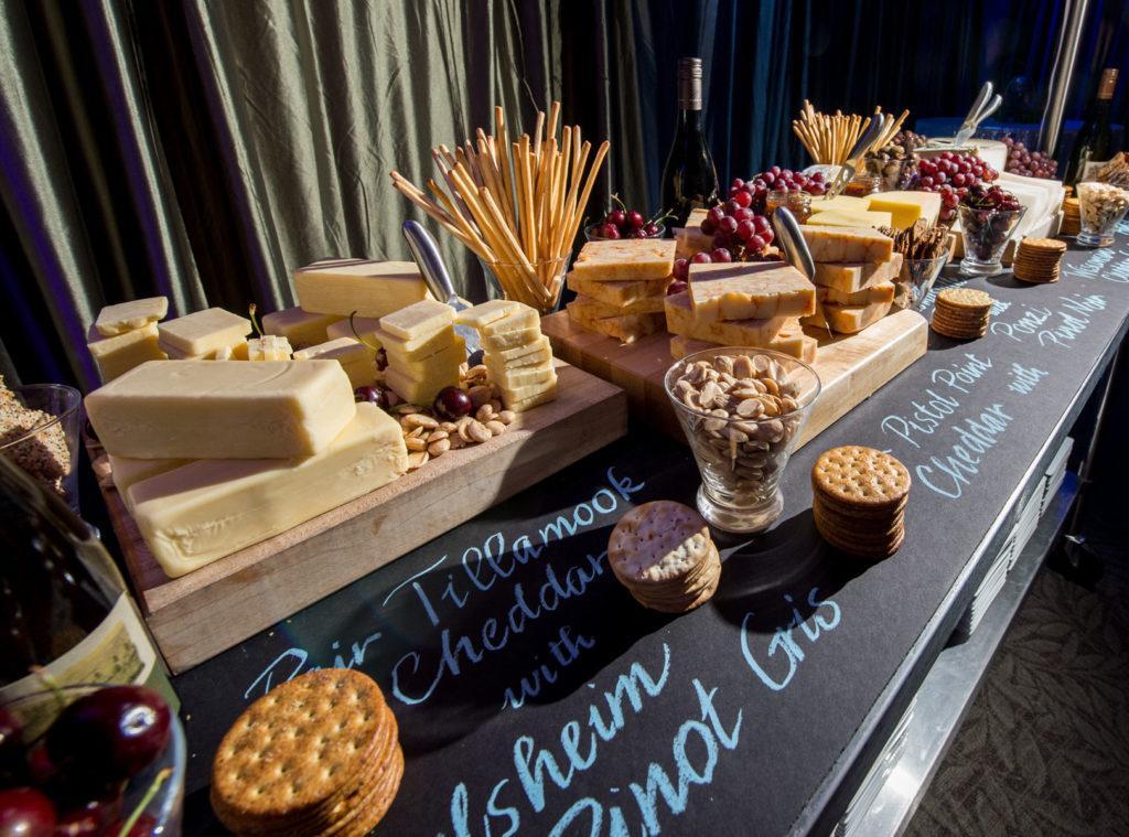 Cheese platter on a chalkboard display by Proof of the Pudding