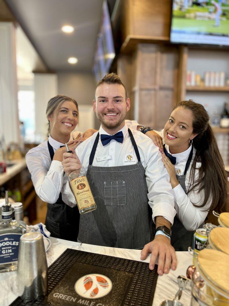 Smiling bartenders at outdoor event