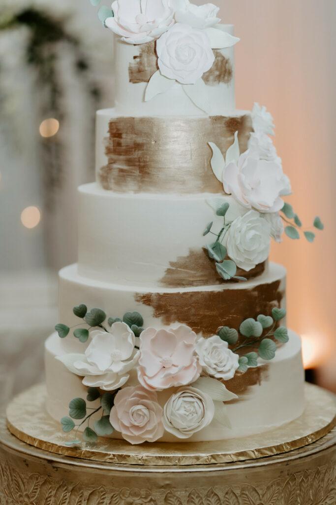 White wedding cake with gold brush stroke