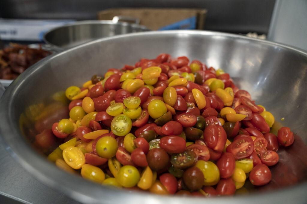 multicolored tomatoes in stainless steel