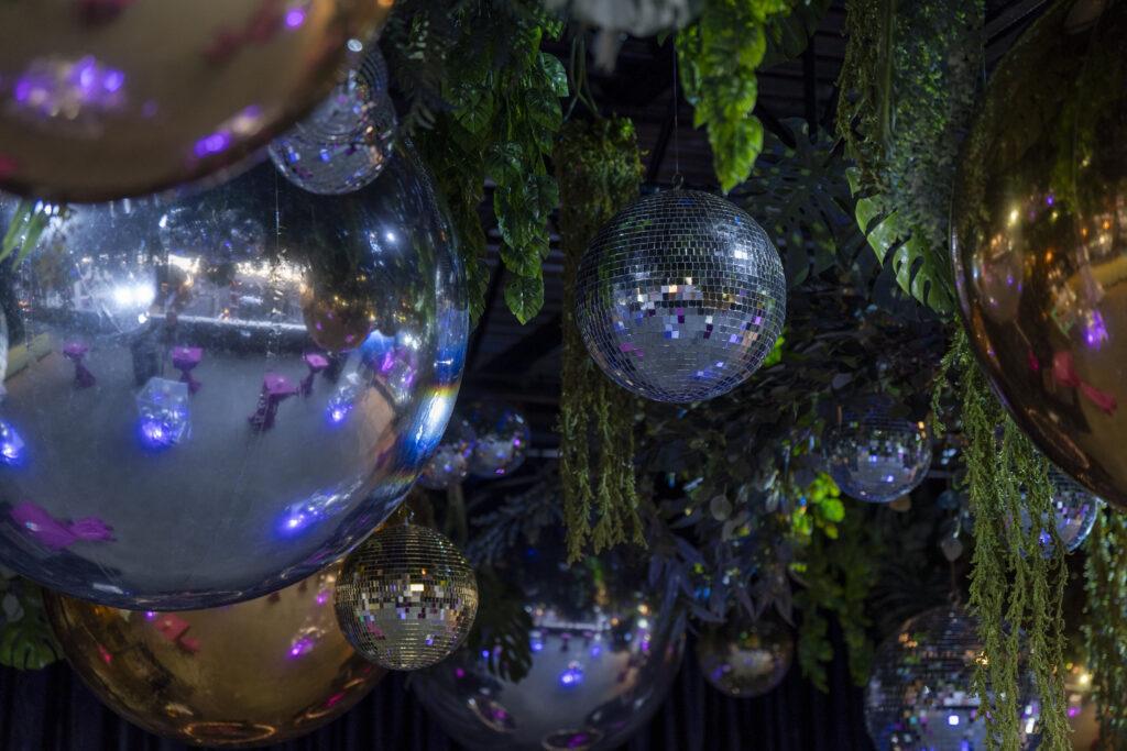 disco balls with foliage ceiling decor