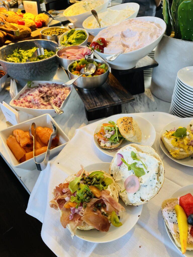 Bagel bar with schmears, toppings, veggies and shakers