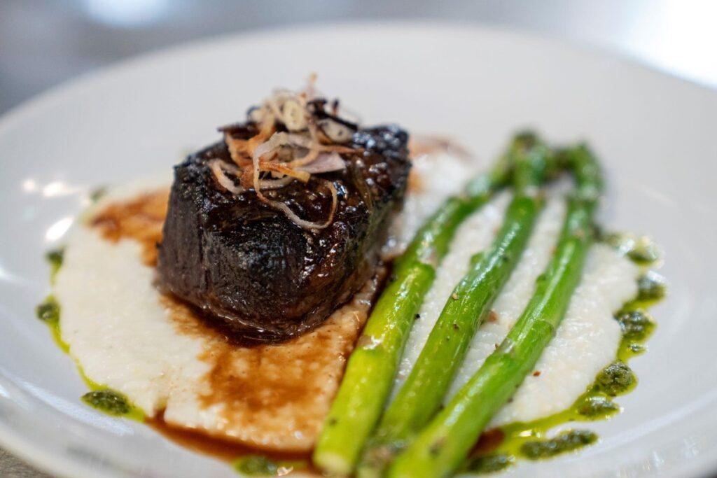 Rosemary Smoked Short Rib served over Anson Mills Grits with Grilled Asparagus
