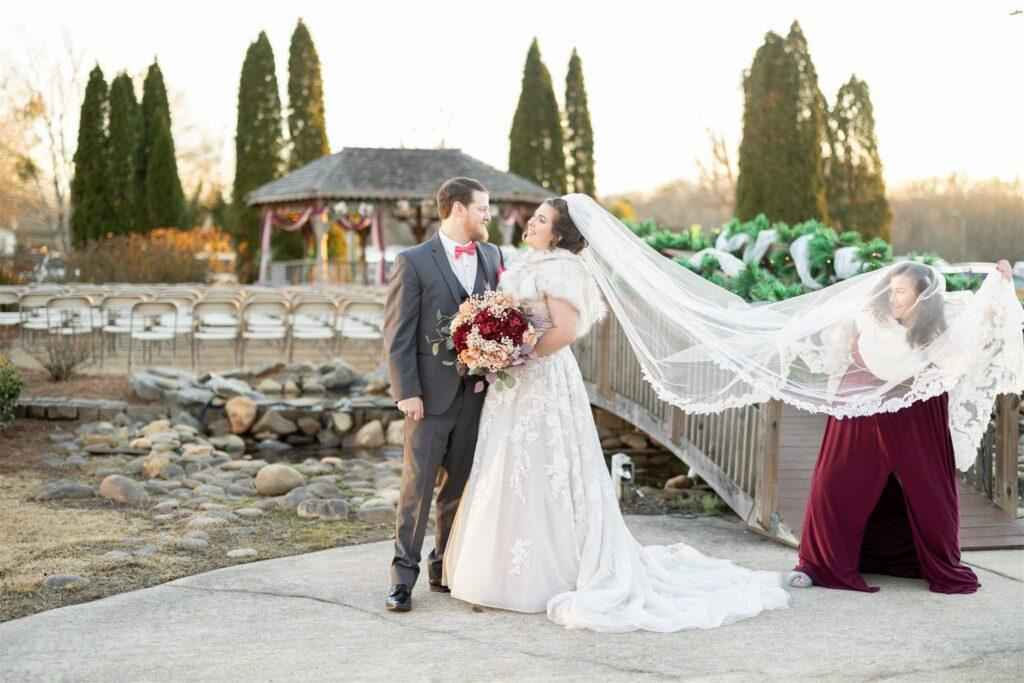 Bride and groom posing for outdoor picturesque photo