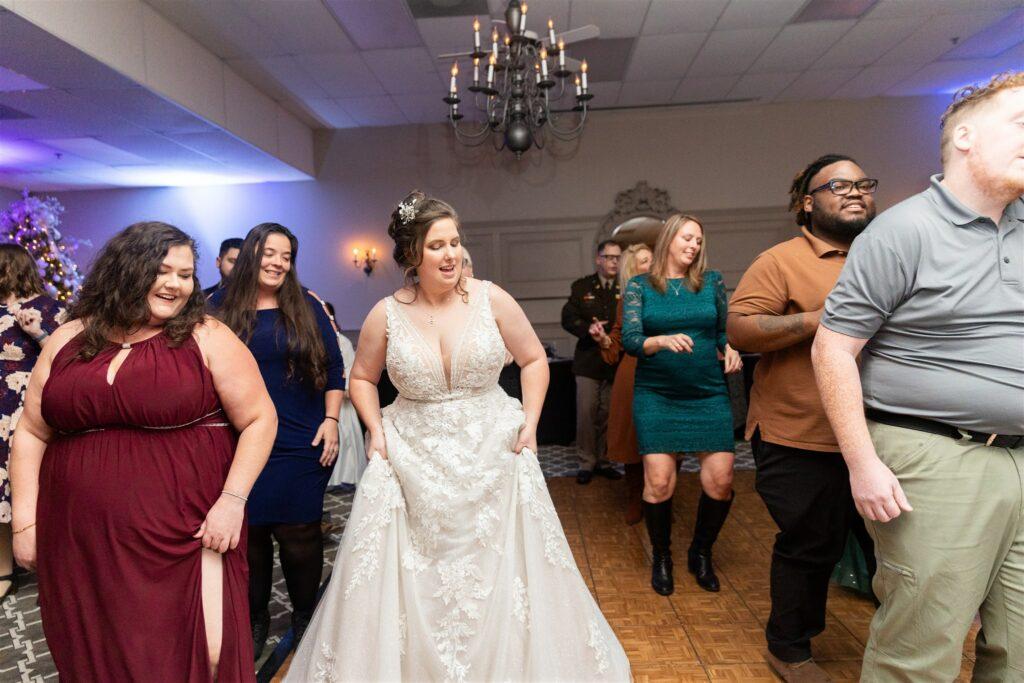 Bride celebrating wedding by dancing